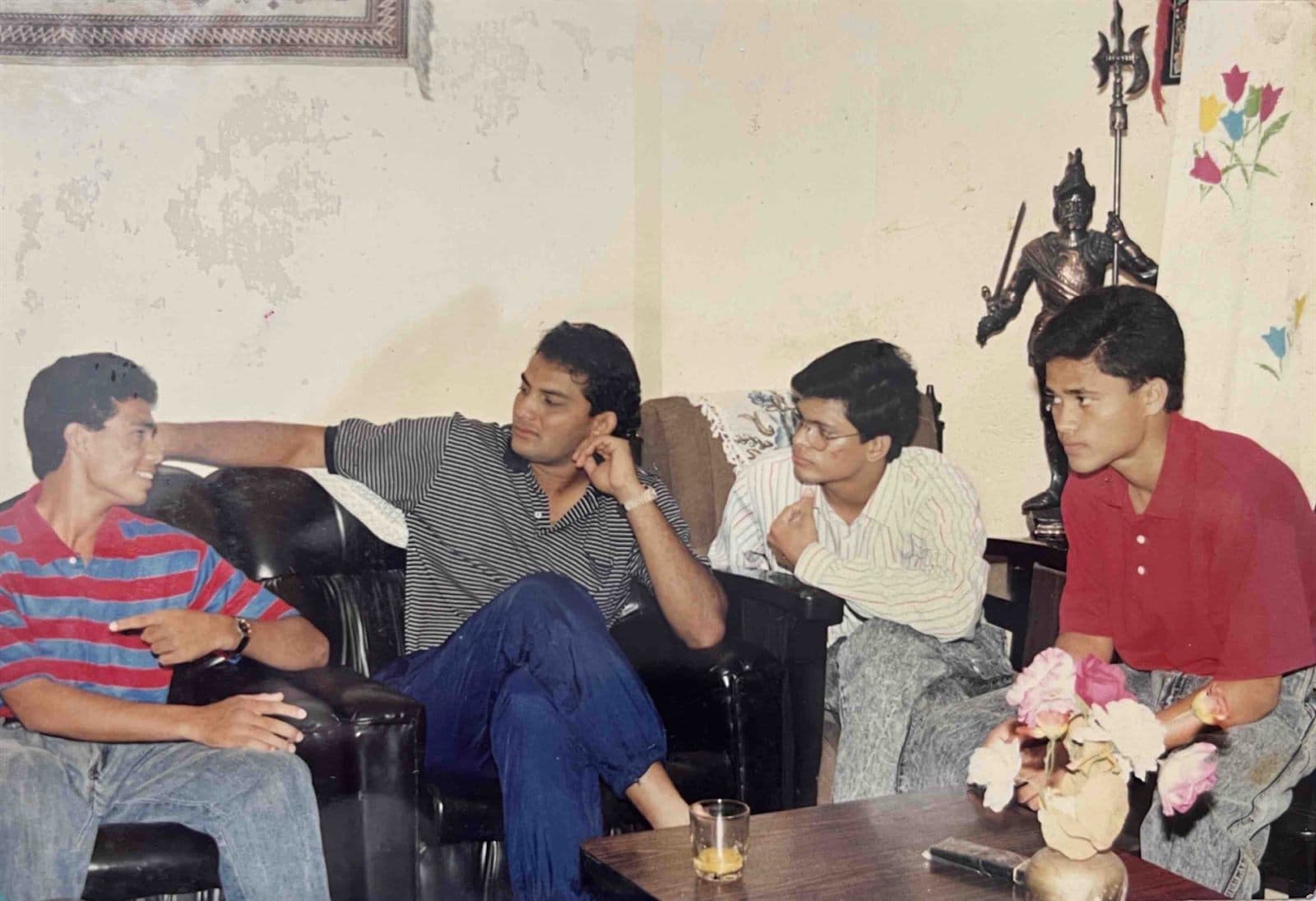 The Young Blood of MF.Khan with Mohammad Azharuddin (1990s) - The next-generation youth of the MF.Khan family sharing a relaxed, candid conversation with former Indian Cricket Captain and style icon Mohammad Azharuddin. | MF.Khan Heritage Archives Visakhapatnam