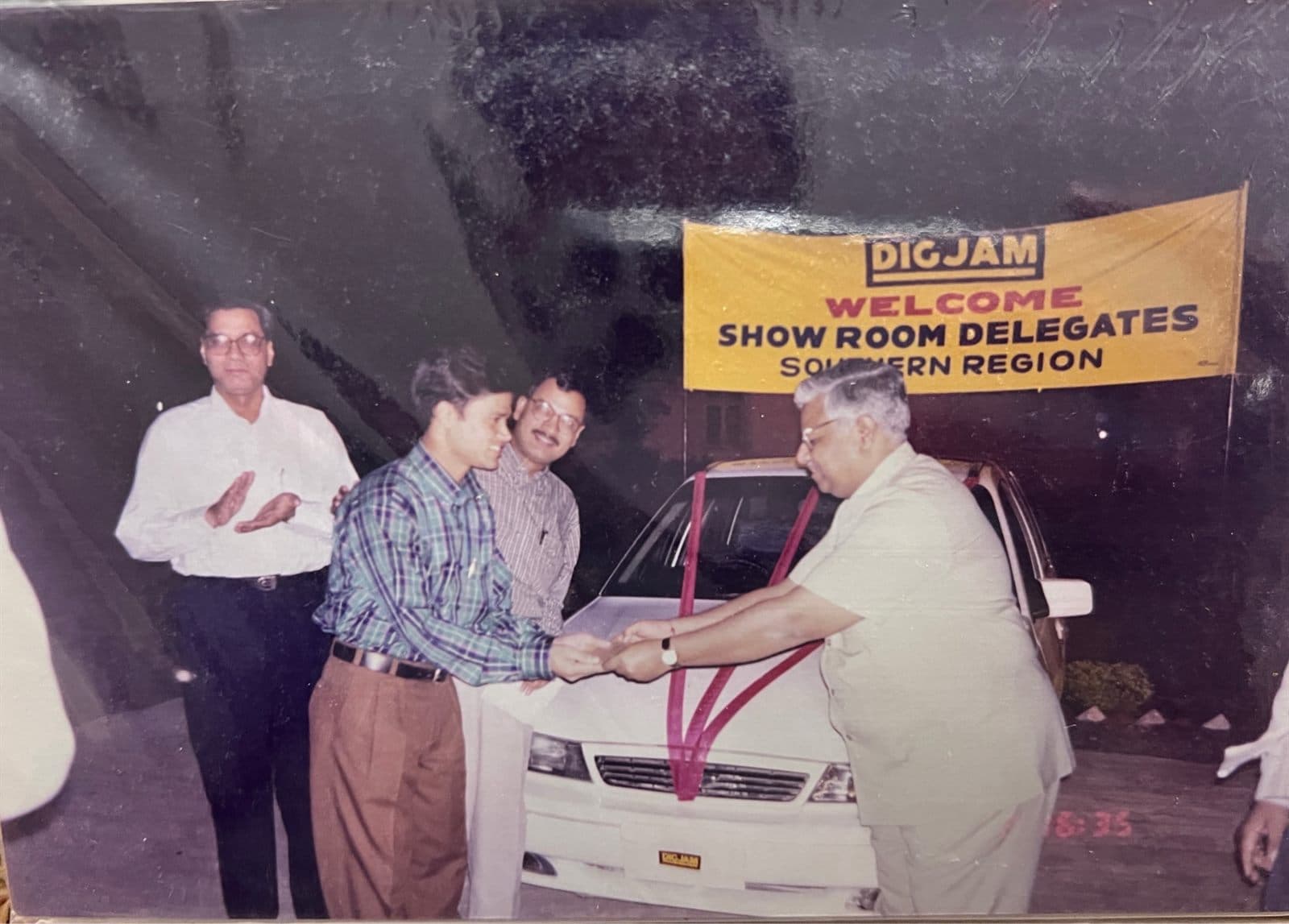 CEO Akbar Khan Awarded New Car by Digjam Mill (1990s) - CEO of MF.Khan International Mr. Akbar Khan winning and receiving a brand new car presented by Digjam Company leadership at the National Showroom Delegates Convention. | MF.Khan Heritage Archives Visakhapatnam