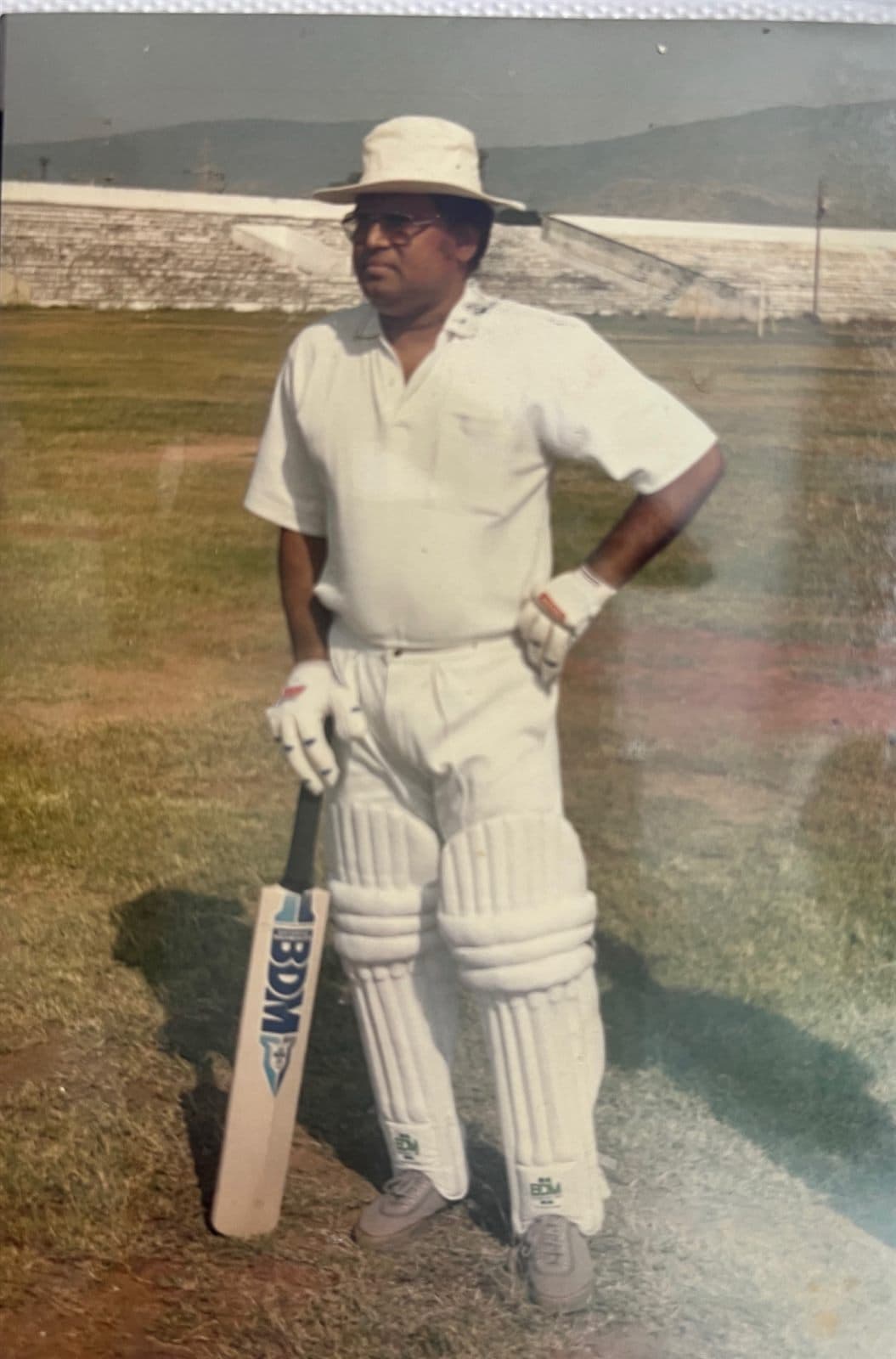 Chairman Ahmed Ali Khan on the Cricket Pitch (1980s - 1990s) - Chairman Mohammed Ahmed Ali Khan geared up in full match whites on the pitch — celebrating his lifelong passion for the gentleman’s game. | MF.Khan Heritage Archives Visakhapatnam