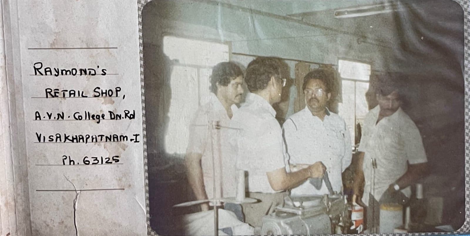 Chairman Overlooking the Master Tailoring Workshop (1980s - 1990s) - Chairman Mohammed Ahmed Ali Khan behind the scenes at the tailoring workshop on AVN College Down Road (Ph. 63125), personally inspecting machine stitching and garment assembly. | MF.Khan Heritage Archives Visakhapatnam