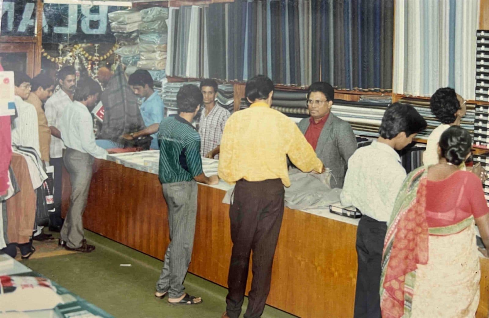 Consultations on the Shop Floor (1980s) - A snapshot of client advisory and master measurement consultations. | MF.Khan Heritage Archives Visakhapatnam