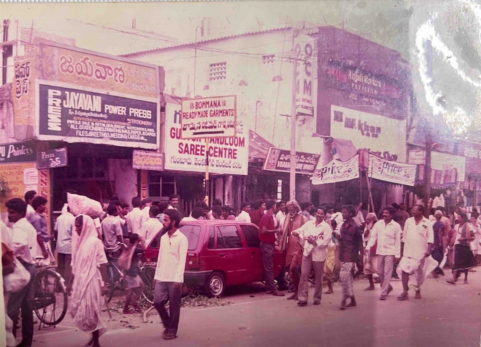 Festive & Wedding Season Rush at Kotharoad (1980s) - Crowds of festive shoppers and wedding patrons bustling outside the iconic MF.Khan shopping precinct in Visakhapatnam. | MF.Khan Heritage Archives Visakhapatnam
