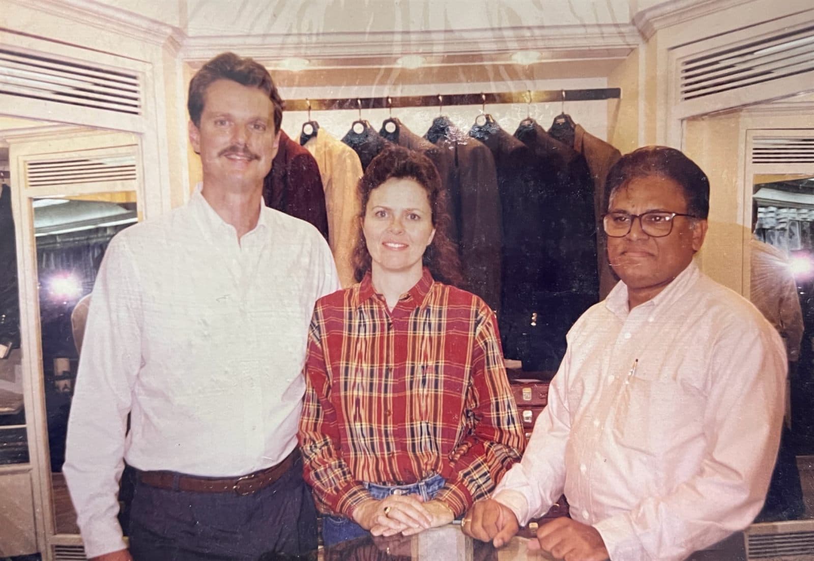 International Patrons Selecting Bespoke Attire (1990s) - Foreign patrons and international visitors shopping for custom tailoring and handcrafted fabrics at MF.Khan Visakhapatnam. | MF.Khan Heritage Archives Visakhapatnam