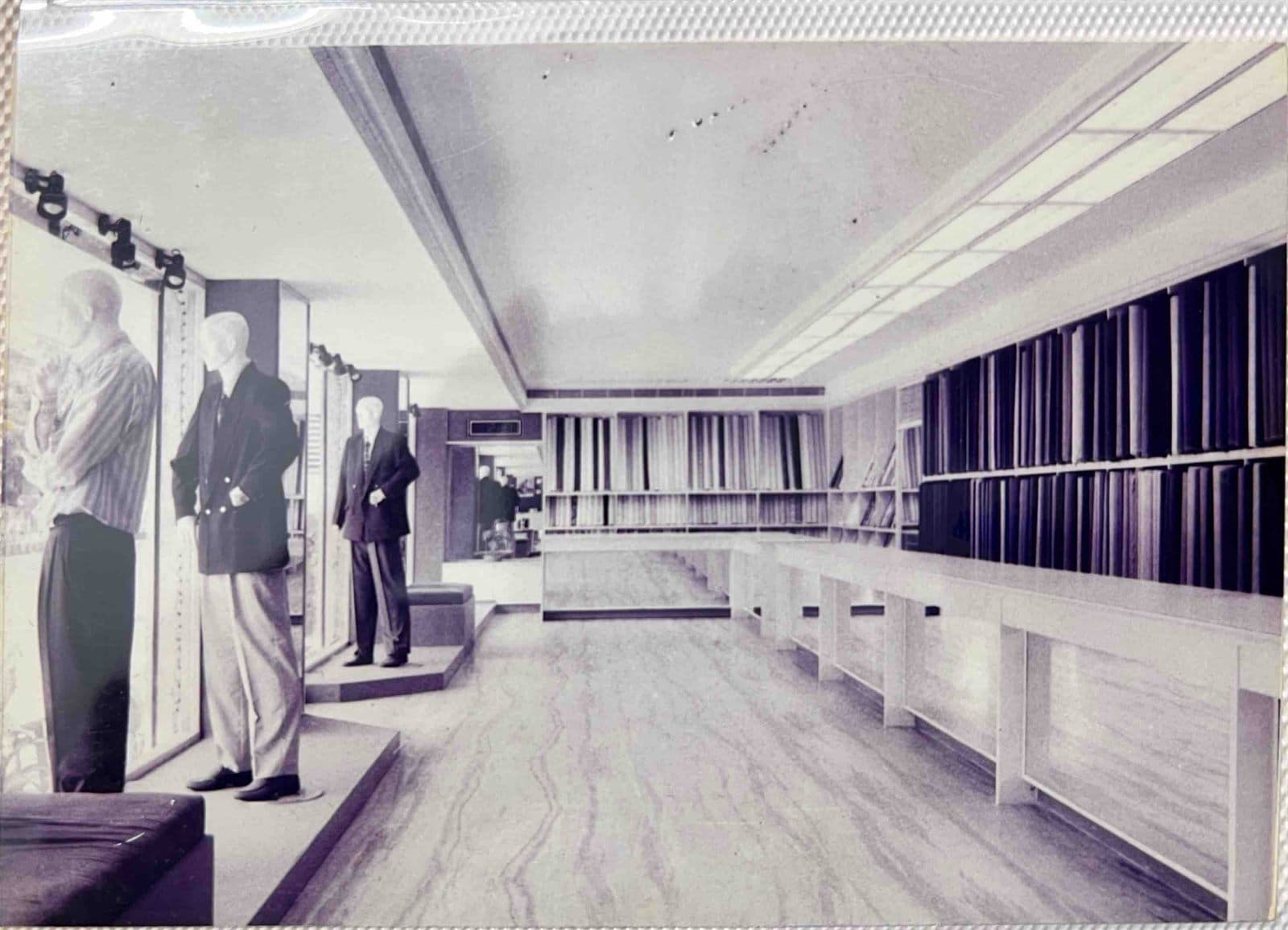 Inside the Exclusive Digjam Showroom (1990s) - A vintage view inside the historic Digjam exclusive showroom established by MF.Khan in Visakhapatnam, featuring bespoke suiting racks and custom tailoring displays. | MF.Khan Heritage Archives Visakhapatnam