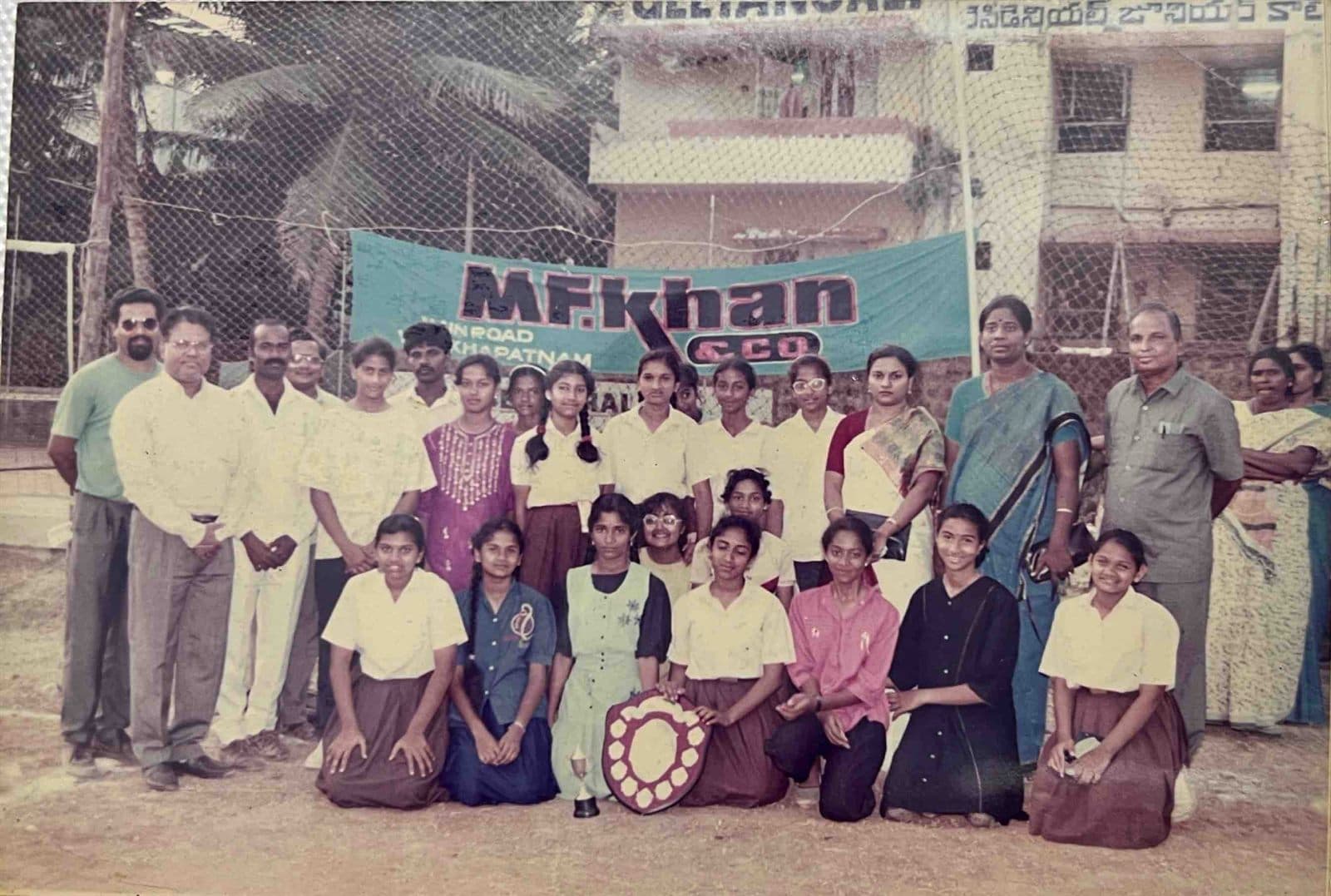 Inter-School Championship Trophy Presentation (1990s) - Student champions proudly presenting their winner’s shield with educators and Chairman Ahmed Ali Khan at the MF.Khan & Co. sponsored tournament. | MF.Khan Heritage Archives Visakhapatnam