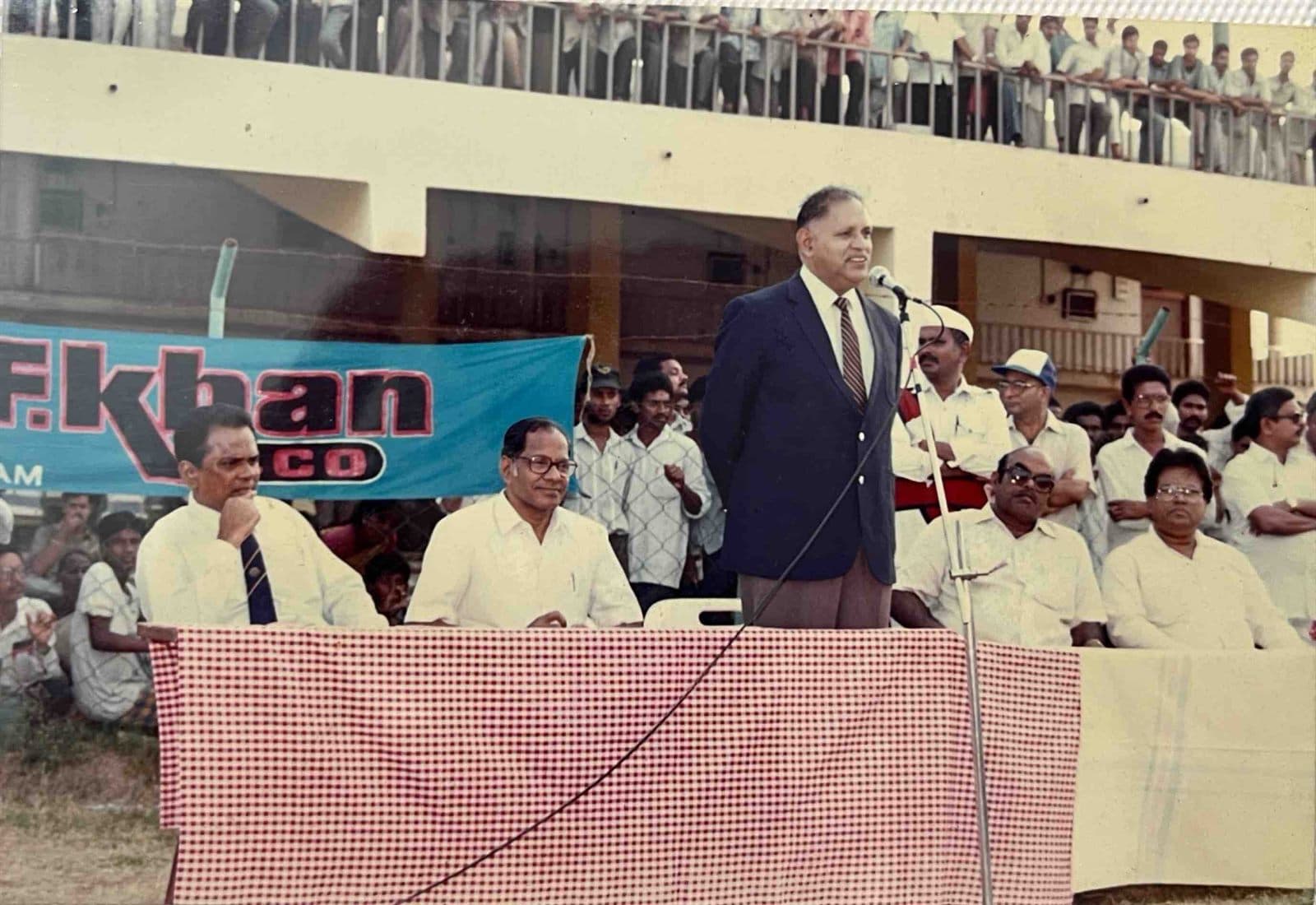 Civic & Sports Championship Address (1990s) - Chairman Mohammed Ahmed Ali Khan and visiting dignitaries presiding over a major stadium sports tournament under the MF.Khan banner in Visakhapatnam. | MF.Khan Heritage Archives Visakhapatnam